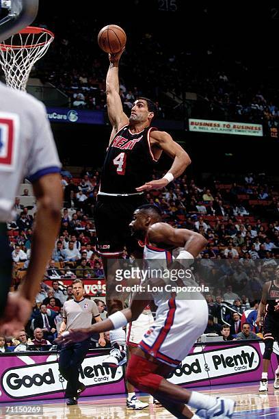 Rony Seikaly of the Miami heat elevates for a dunk during a game against the New Jersey Nets in 1988 at Brendan Byrne Arena in East Rutherford, New...