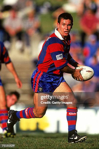 Matthew Johns of the Knights looks to offoad during a ARL match between the Balmain Tigers and the Newcastle Knights at Leichhardt Oval 1997, in...