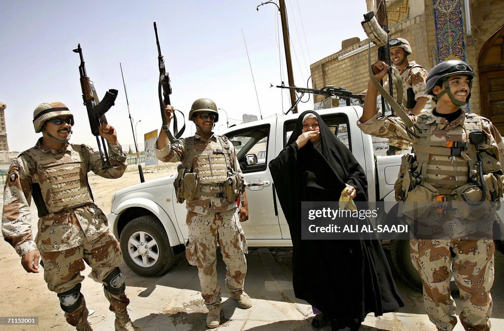 An Iraqi woman shares Iraqi soldiers the