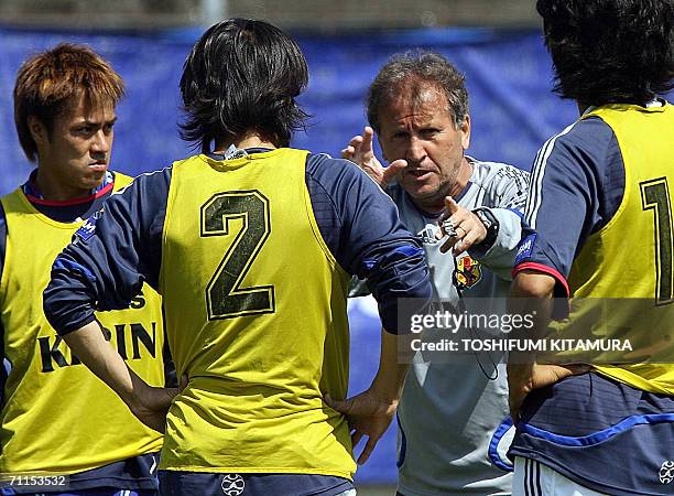 Japanese head coach Zico from Brazil speaks to his defenders, Yuichi Komano , Tsuneyasu Miyamoto and Yuji Nakazawa during the afternoon training...