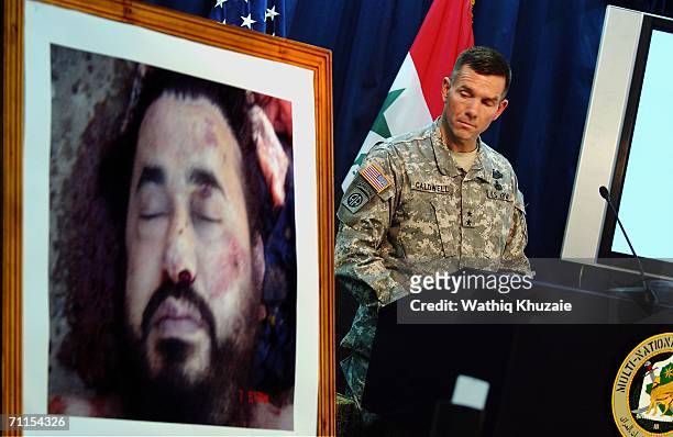 Spokesman of Multi-National Force-Iraq Major General Bill Caldwell speaks during a press conference as a picture of the killed leader of al-Qaeda in...
