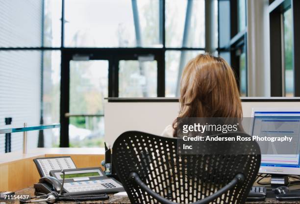 businesswoman working at her desk - secretary pics stock pictures, royalty-free photos & images