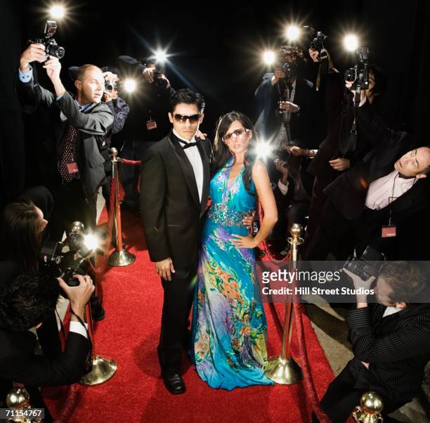 celebrity couple smiling on the red carpet - red carpet event celebrity stock pictures, royalty-free photos & images
