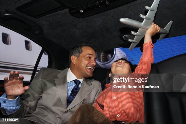 father and son playing with an airplane in a limo - privatbesitz schild stock-fotos und bilder