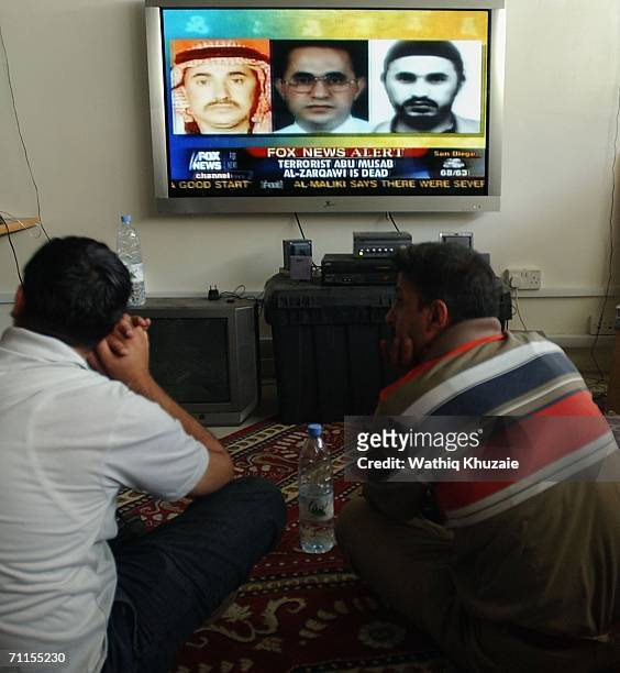 Iraqi journalists watch a television showing news about the killing of the leader of al-Qaeda in Iraq Abu Musab al-Zarqawi June 8, 2006 in Baghdad,...