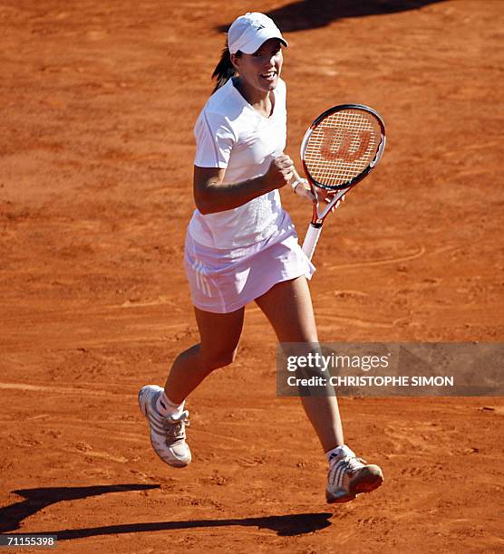 Belgian Justine Henin-Hardenne jubilates after winning against Belgian Kim Clijsters during the semi-finals of the French tennis Open at Roland...