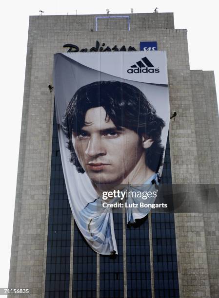 Giant poster of Argentinian footballer Lionel Messi is unveiled at SAS Radisson Hotel on June 8, 2006 in Hamburg, Germany.