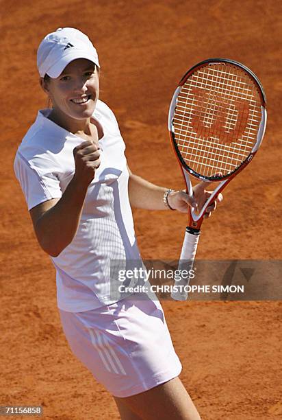 Belgian Justine Henin-Hardenne jubilates after winning against Belgian Kim Clijsters during the semi-finals of the French tennis Open at Roland...