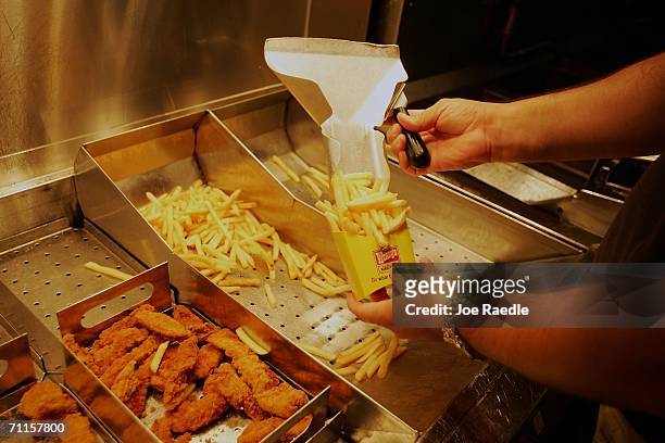 Wendy's french fries and chicken nuggets are placed in an order June 8, 2006 in Miami, Florida. In a move that significantly reduces trans fatty...