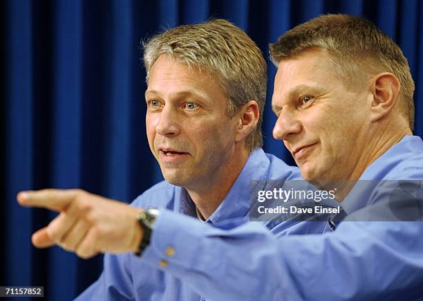 Mission Specialist Piers Sellers, of the United Kingdom, points out a member of the audience to fellow crew member Thomas Reiter, of Germany, prior...