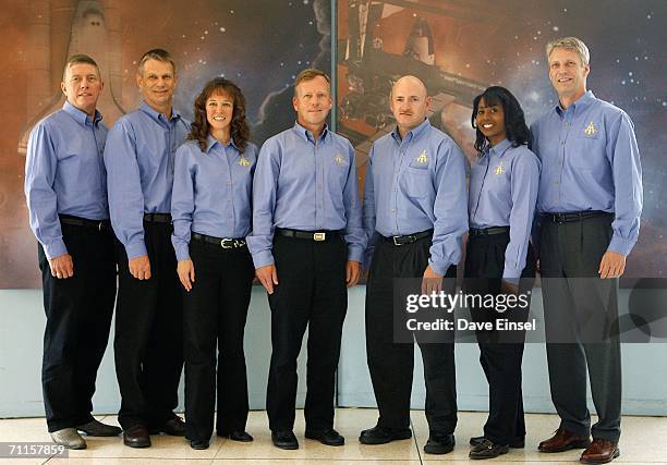 Crew members Mike Fossum, Piers Sellers, of the United Kingdom, Lisa Nowak, Steve Lindsey, Mark Kelly, Stephanie Wilson and Thomas Reiter, of...