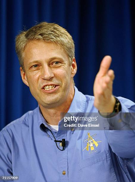 Crew member Thomas Reiter, of Germany, gestures as he comments during a briefing at Johnson Space Center June 8, 2006 in Houston, Texas. The Shuttle...