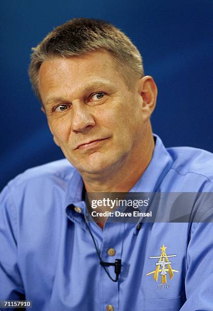 Mission specialist Piers Sellers, of the United Kingdom, listens to a question during a briefing at Johnson Space Center June 8, 2006 in Houston,...