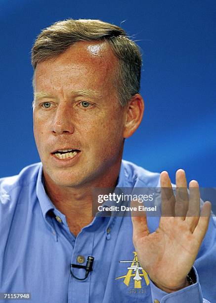 Commander Steve Lindsey gestures as he comments during a briefing at Johnson Space Center June 8, 2006 in Houston, Texas. The Shuttle Discovery is...