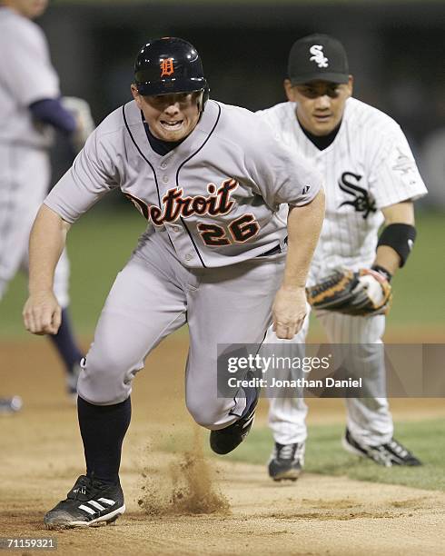 Chris Shelton of the Detroit Tigers gets caught in a rundown as second baseman Tadahito Iguchi of the Chicago White Sox chases him on June 8, 2006 at...