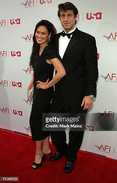Actress Tia Carrere and husband photographer Simon Wakelin arrive at the 34th AFI Life Achievement Award tribute to Sir Sean Connery held at the...