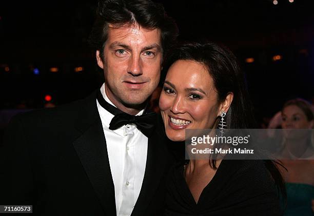Actress Tia Carrere and husband photographer Simon Wakelin pose during the 34th AFI Life Achievement Award tribute to Sir Sean Connery held at the...