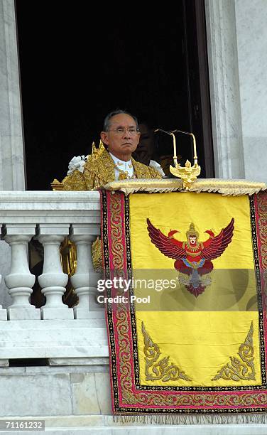 Thailand's King Bhumibol Adulyadej addresses the thousands of people waiting outside the Royal Plaza to pay tribute to King Bhumibol Adulyadej on...