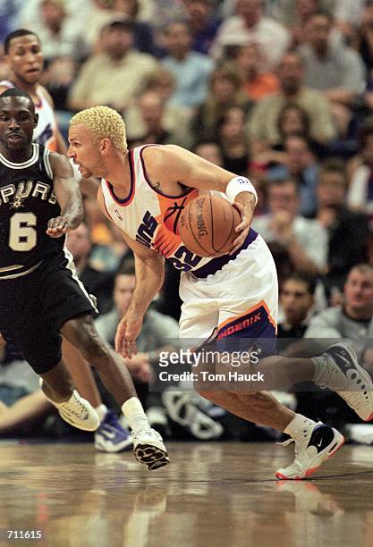 Jason Kidd of the Phoenix Suns dribbles the ball during the Play-Off Game 4/Round 1 against the San Antonio Spurs at the AmericanWest Arena in...