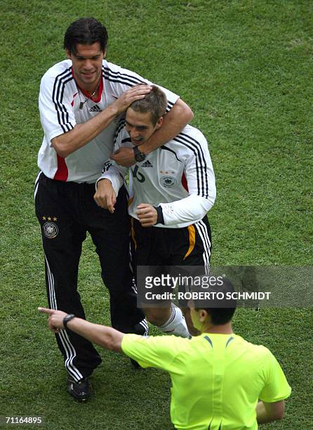 German midfielder Michael Ballack congratulates teammate Philipp Lahm after the latter scored the first goal against Costa Rica in the first half of...