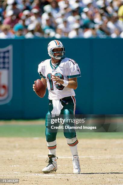 Quarterback Dan Marino, of the Miami Dolphins, drops back to pass during a game on September 7, 1997 against the Tennessee Titans at Joe Robbie...