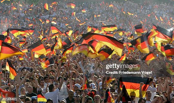 Thousands of football fans with German national flags celebrate the start of the World Cup 2006 at the 'Heiligengeistfeld', a public viewing zone in...