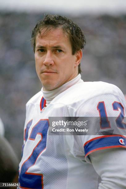 Quarterback Jim Kelly of the Buffalo Bills looks on during the game against the Los Angeles Raiders at the Los Angeles Memorial Coliseum on December...