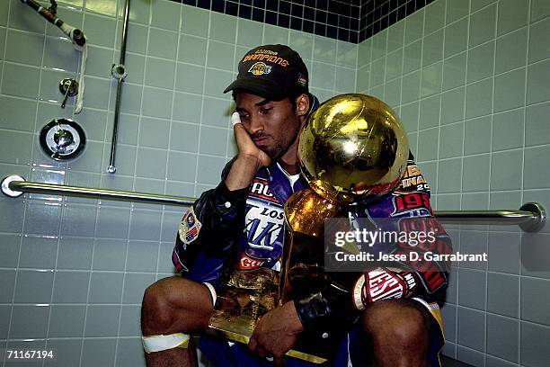 Kobe Bryant of the Los Angeles Lakers poses with the NBA Championship trophy after defeating the Philadelphia 76ers in game five of the 2001 NBA...