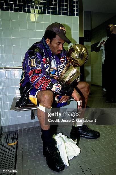 Kobe Bryant of the Los Angeles Lakers poses with the NBA Championship trophy after defeating the Philadelphia 76ers in game five of the 2001 NBA...