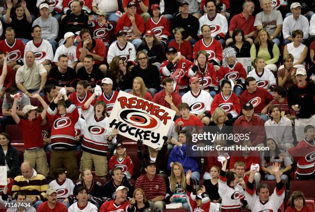 Fans hold a sign in support of the Carolina Hurricanes during game two of the 2006 NHL Stanley Cup Finals against the Edmonton Oilers during on June...