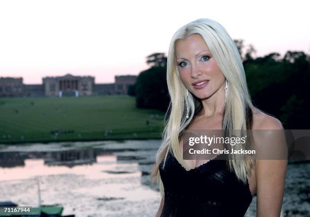 Model Caprice poses in front of Stowe school as she arrives at the Silverstone Grand Prix Ball on June 9, 2006 in Stowe, England