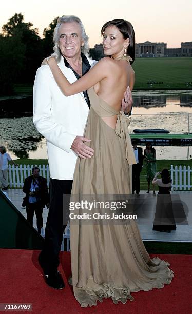 Peter Stringfellow and his girlfriend pose in front of Stowe school as she arrives at the Silverstone Grand Prix Ball on June 9, 2006 in Stowe,...