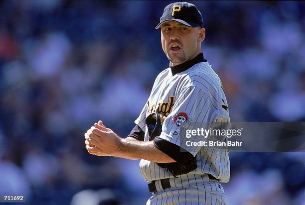 Mike Williams of the Pittsburgh Pirates lines up the pitch during the game against the Colorado Rockies at Coors Field in Denver, Colorado. The...