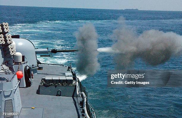 In this handout photo provided by the Israeli Defense Forces, an Israeli naval gunboat fires shells at Palestinian targets on the beach June 9, 2006...