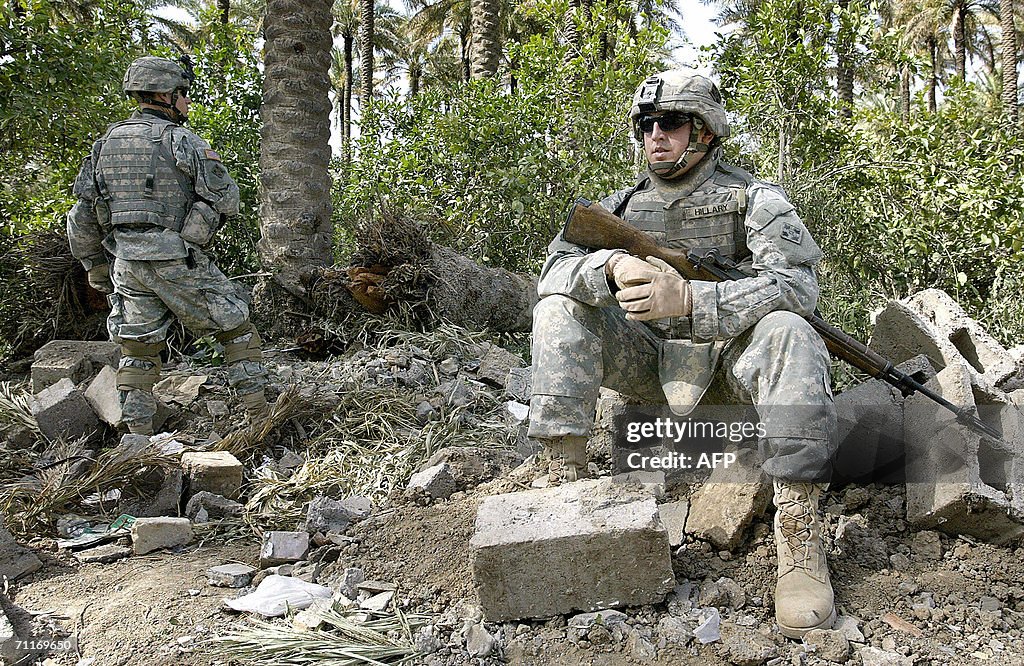 U.S. Army 4th Infantry Division soldiers guard at the scene of the ...