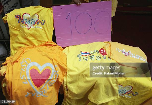 Shirts with the words 'We love the King' and other praises for Thailand's revered King Bhumibol Adulyadej are displayed on June 10th 2006 in Bangkok,...