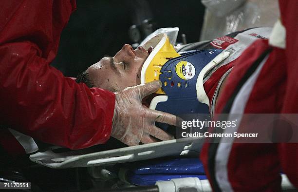 Luke Ball of the Saints is stretchered off the field after injuring himself during the round 11 AFL match between the Sydney Swans and the St Kilda...