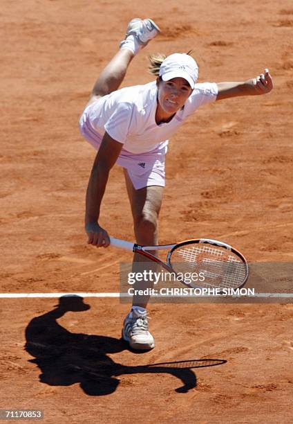 Belgian Justine Henin-Hardenne serves to Russian Svetlana Kuznetsova during the French tennis Open finals at Roland Garros in Paris 10 June 2006. AFP...