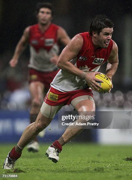 Adam Schneider of the Swans runs during the round 11 AFL match between the Sydney Swans and the St Kilda Saints at the Sydney Cricket Ground June 10,...