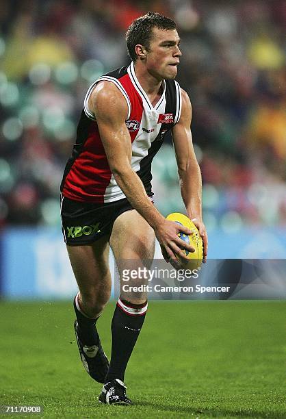 Leigh Fisher of the Saints runs the ball during the round 11 AFL match between the Sydney Swans and the St Kilda Saints at the Sydney Cricket Ground...