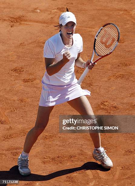 Belgian Justine Henin-Hardenne jubilates after winning a point against Russian Svetlana Kuznetsova during the French tennis Open final at Roland...