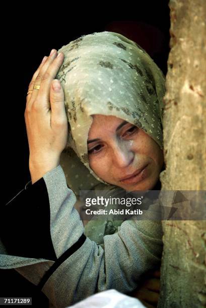 Relative of Palestinians, who were killed by Israeli artillery fire on a crowded Gaza beach, mourn during their funeral, on June 10, 2006 in Beit...