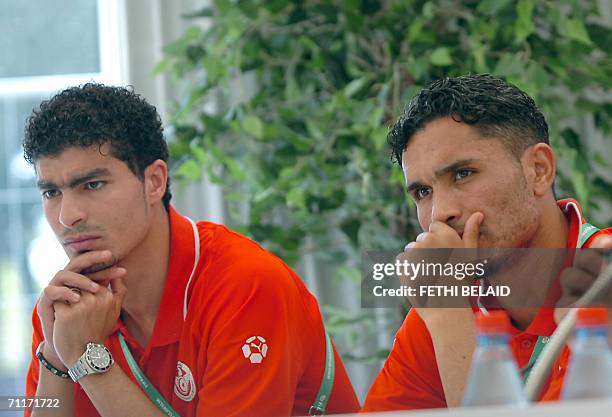 Tunisian defenders Anis Ayari and Karim Saidi are seen during a press conference at Saks Stadium in Schweinfurt, 10 June 2006. Tunisia will contest...