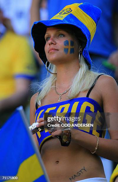 Swedish football supporter wears colours of her team in Dortmund Stadium, 10 June 2006, prior to the 2006 World Cup group B match between Trinidad...
