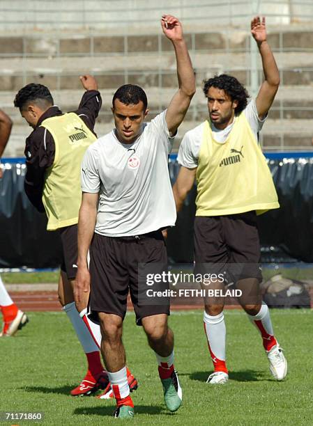 Tunisian midfielder Jawhar Mnari and Tunisian midfielder Sofiane Melliti exercise during a training session at Saks Stadium in Schweinfurt, 10 June...