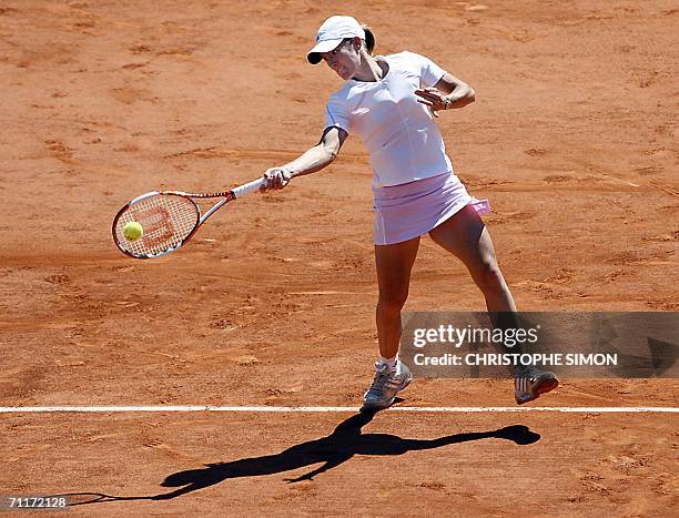 Belgian Justine Henin-Hardenne hits a shot to Russian Svetlana Kuznetsova during the French tennis Open finals at Roland Garros in Paris 10 June...