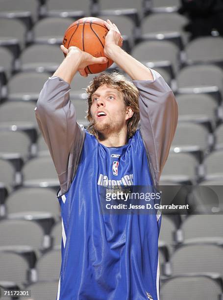 Dirk Nowitzki of the Dallas Mavericks shoots the ball a during a team practice prior to Media Availability the day before Game Two of the 2006 NBA...