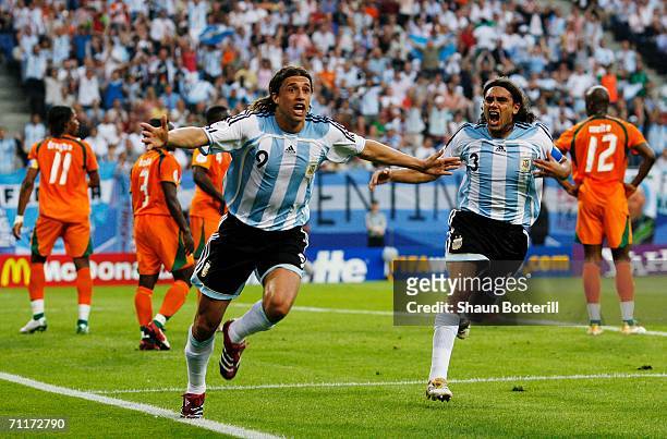 Hernan Crespo of Argentina celebrates scoring his team's first goal with team mate Juan Sorin during the FIFA World Cup Germany 2006 Group C match...