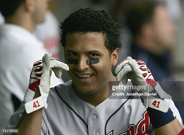 Victor Martinez of the Cleveland Indians celebrates in the dugout after hitting his second solo home run of the game against the Chicago White Sox in...