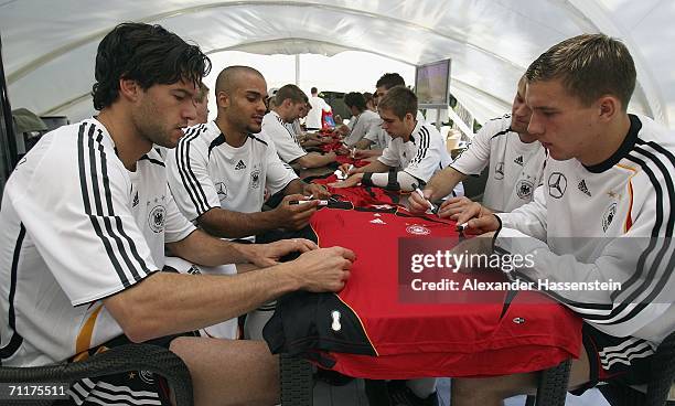 Michael Ballack and Lukas Podolski seen during the Germany national football team autographing session at the squad hotel on June 11, 2006 in Berlin...